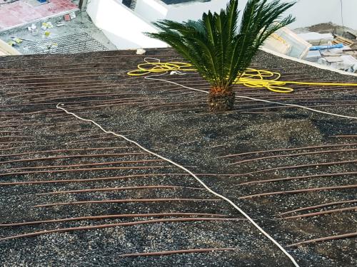 Irrigation driplines on a pitched roof