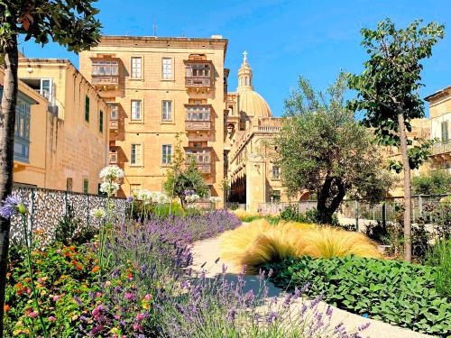 Roof garden with mediterranean shrubs, lavender and small trees