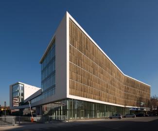 Office building with bamboo slats infront of the glazed façades