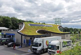 Curving green roof of a motorway service station