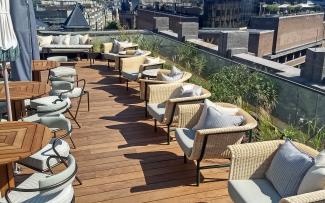 Roof terrace with wooden decking and chairs