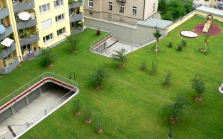 Green roof with lawn on top of an underground garage